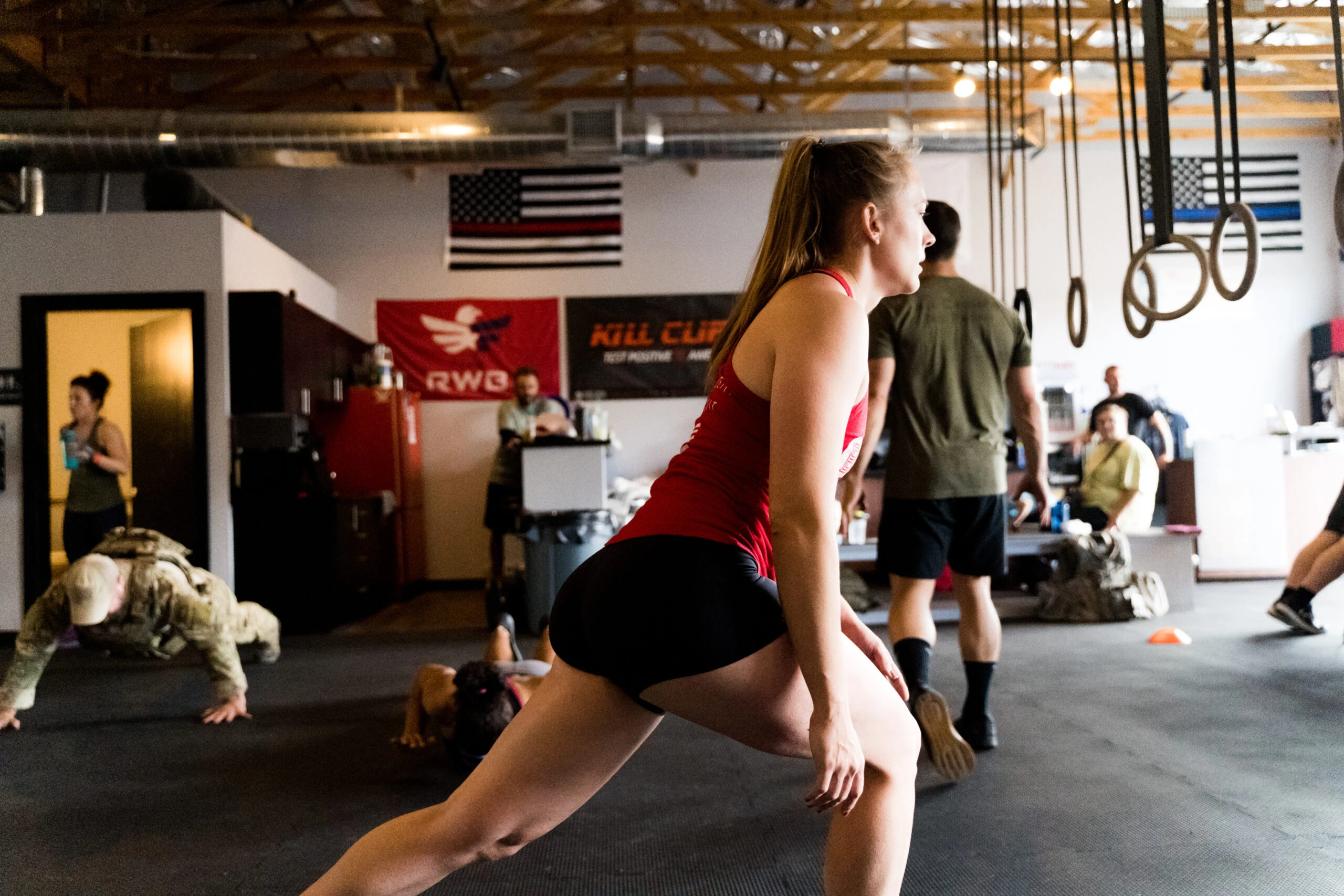 Woman doing a lunge in a gym